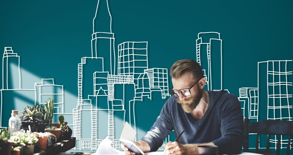 Caucasian man working with building illustration on green background